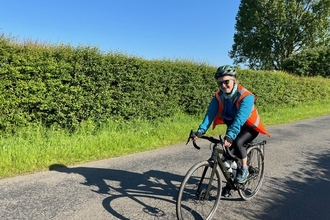 Libby John cycling in sunshine