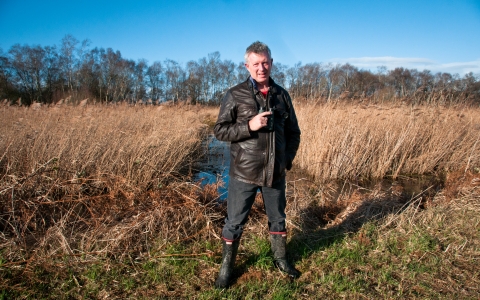 Stephen standing in front of wetland