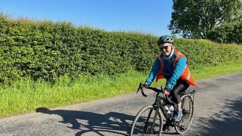 Libby John cycling in sunshine