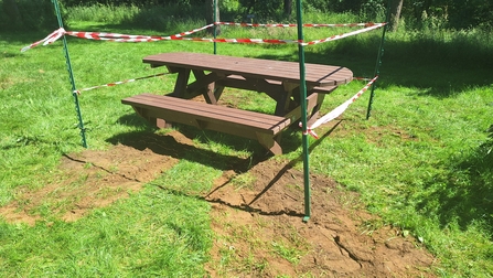new picnic bench at Snipe Dales with tape around it