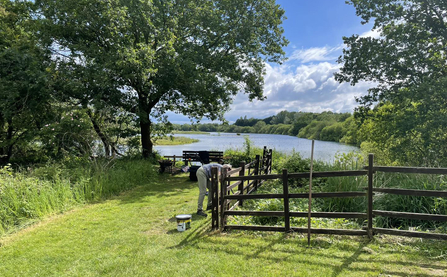 Volunteer painting fencing at Whisby Nature Park near Lincoln