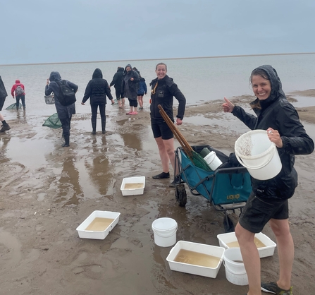 Marine Interns sea dipping in the rain