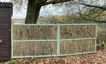 Newly refreshed reed screens beside Hide One at Whisby