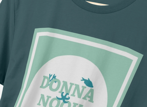 Close-up of a navy T-shirt with Donna Nook design on the front